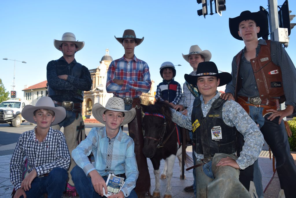 RODEO KIDS: Students from the Warwick High Schools Rodeo program in all their gear, hand out flyers for tonight's Bull Ride accompanied by Cheeky the miniature pony.